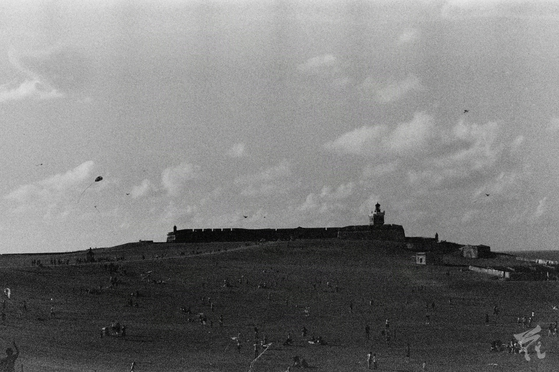 El Morro's grass yard on a sunny day. This is a black and white analog photograph.